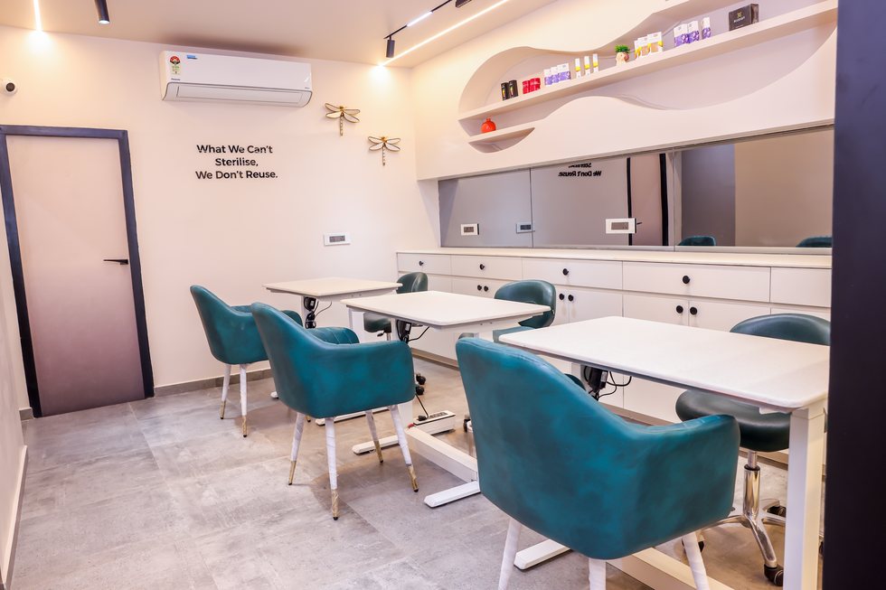 Manicure stations and mirrors inside the Based Aesthetics studio